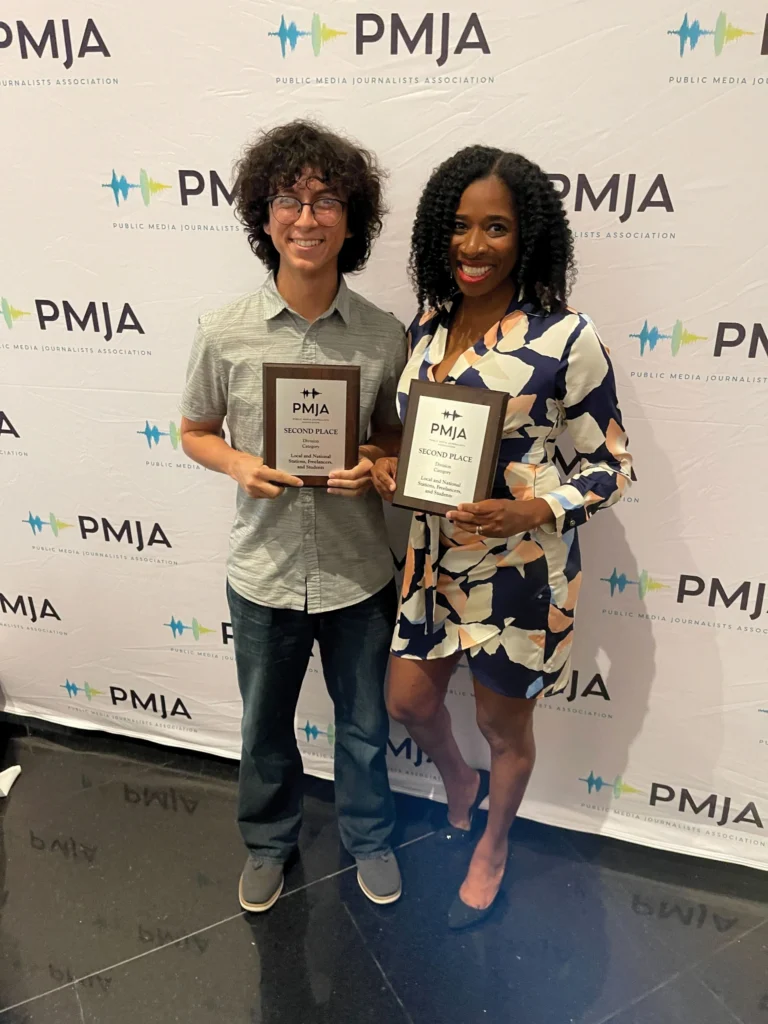 LaToya Dennis and Luis-Alfredo Garcia holding awards