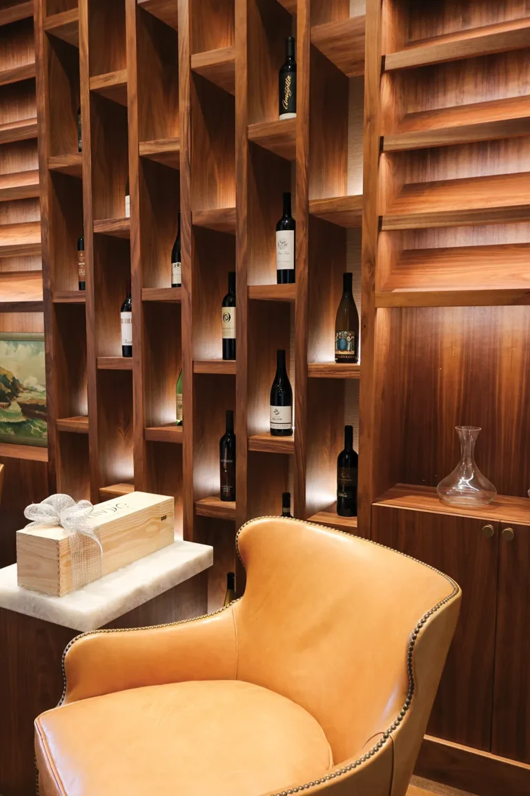 A cozy wine room lined with wooden shelves
