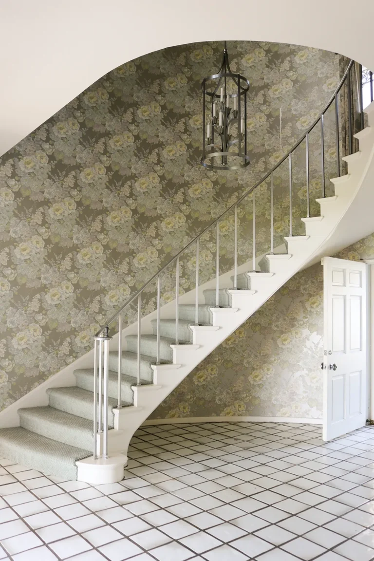 An elegant curving white staircase