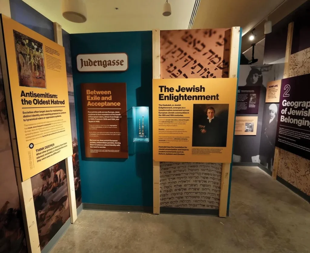 Museum exhibits hang on the wall in colorful blocks