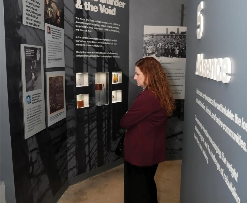A visitor looks at a museum exhibit