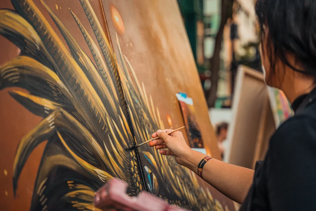 A person painting a mural