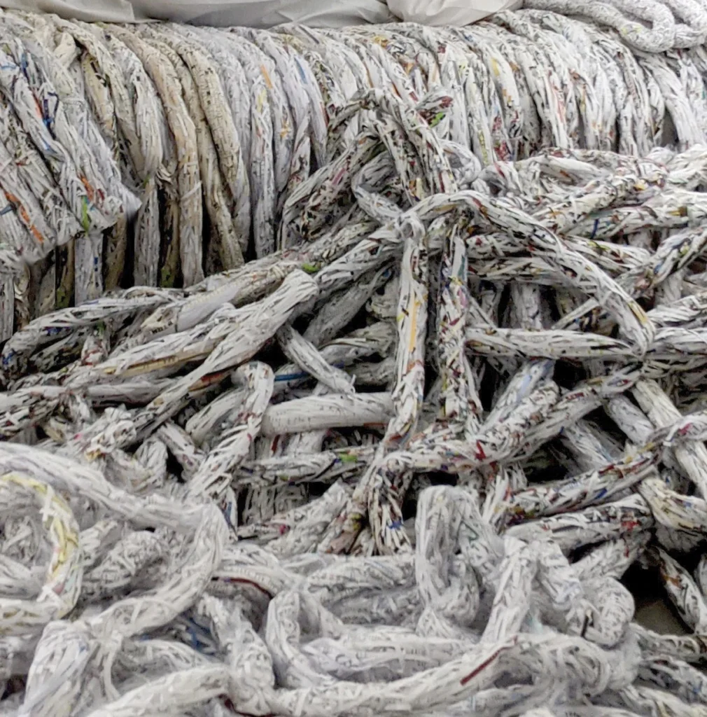 Artwork that resembles tumbles of gray yarn