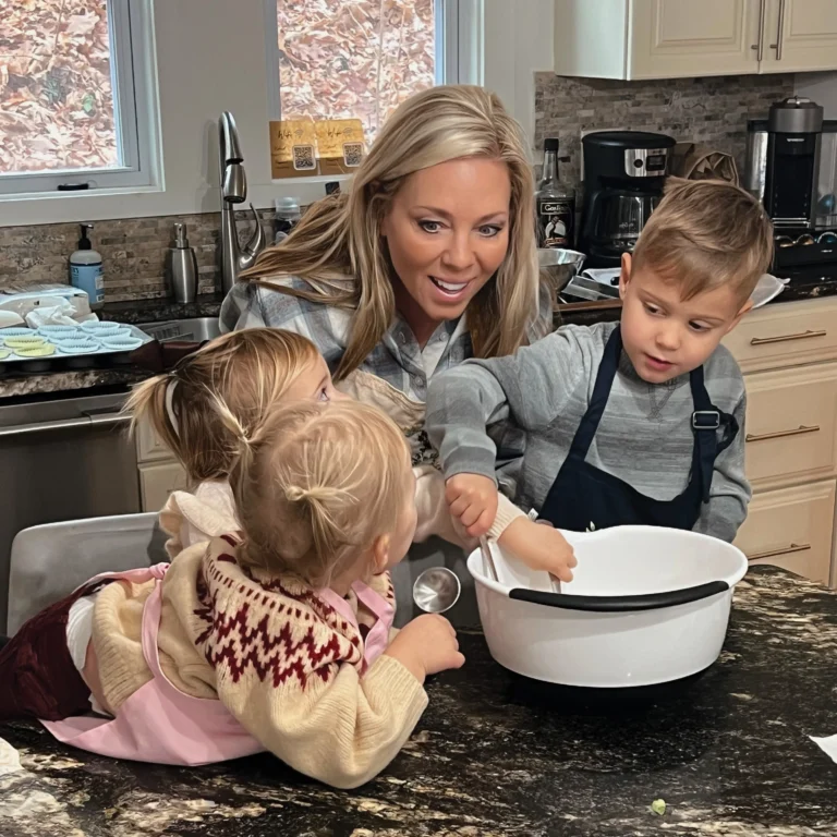 Cindy Bowman LaFronz baking with two of her grandchildren in a kitchen
