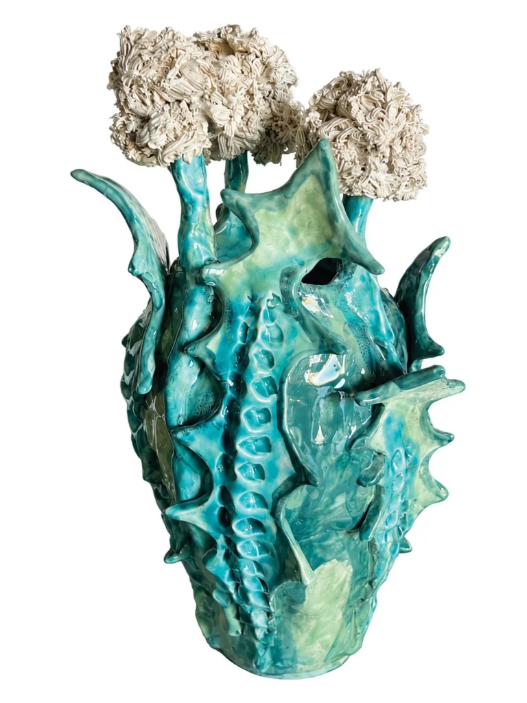 Turquoise ceramic vase with dandelion-like tops