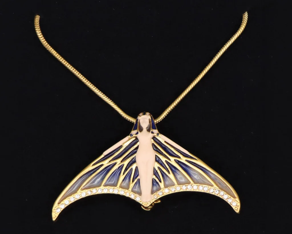 Gold-tone winged nymph pendant with crystals on a snake chain