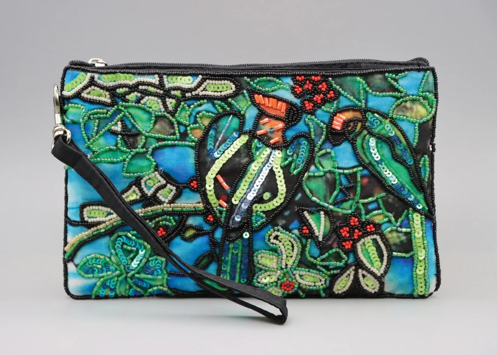 Beaded clutch bag with a parrot and foliage design