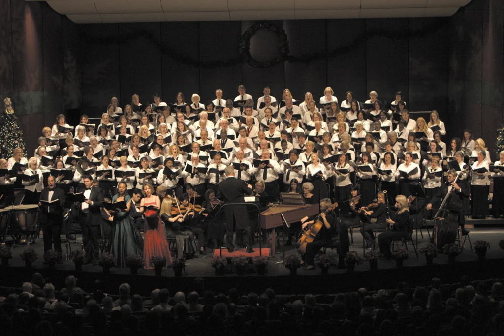 Choir and orchestra performing Messiah in a concert hall